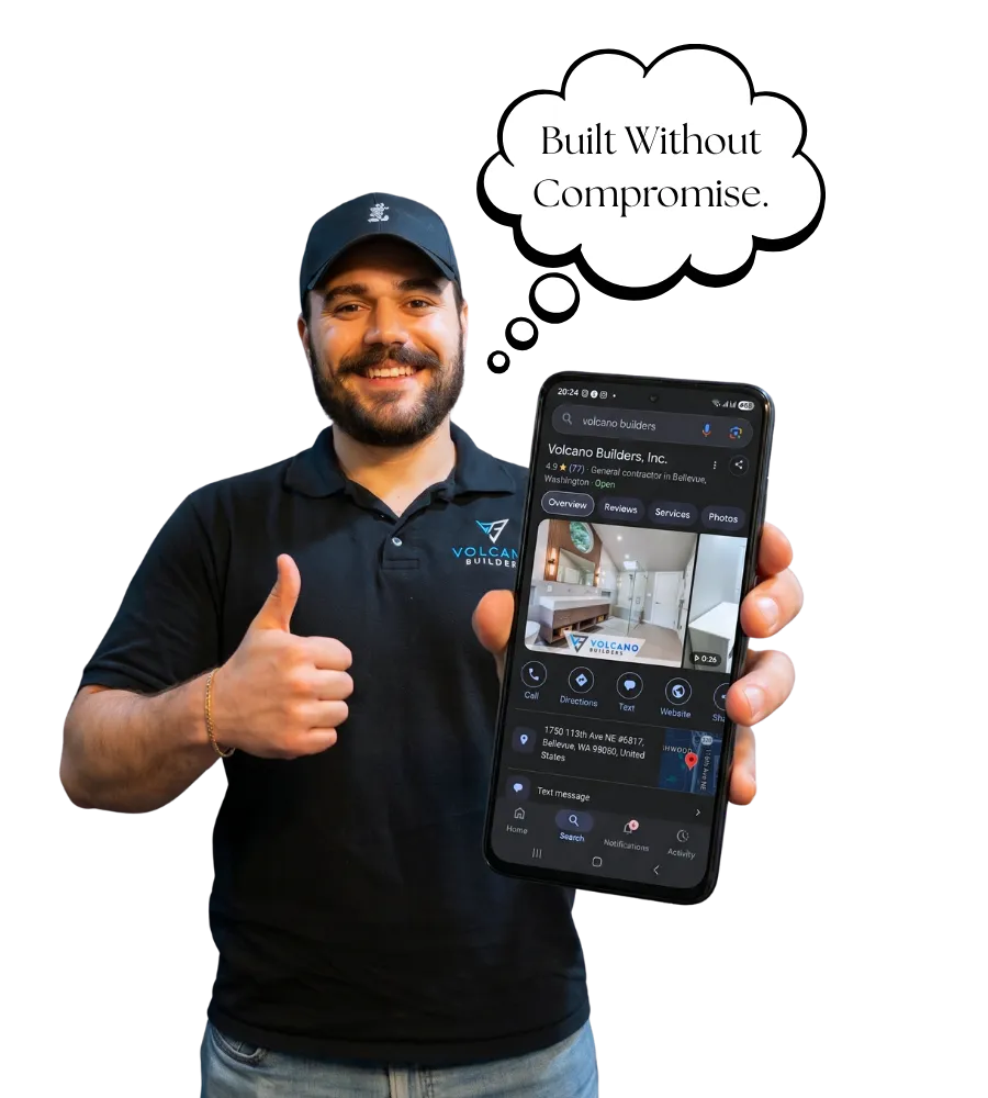 Volcano Builders team member holding a phone showing the Google Business listing, Built Without Compromise