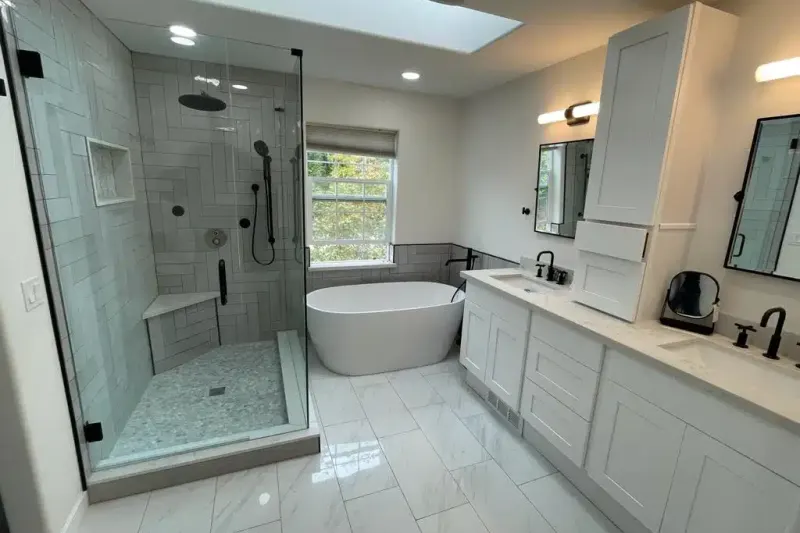 Primary bathroom remodel by Volcano Builders, glass shower, freestanding tub and double vanity