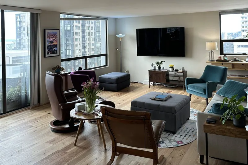Living room with new wide plank hardwood flooring, from a Seattle flooring remodel by Volcano Builders