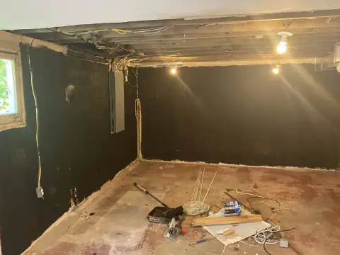 Block foundation walls during a basement remodel by Volcano Builders
