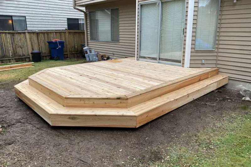 Two-step cedar deck built by Volcano Builders behind a home in Snohomish, WA