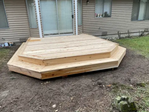 Two level wood platform deck outside a sliding door in Snohomish, WA
