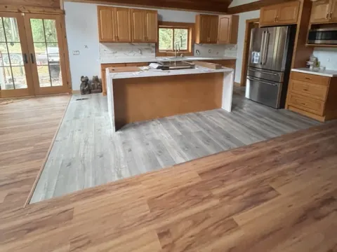 Wood look plank flooring in Monroe, WA by Volcano Builders