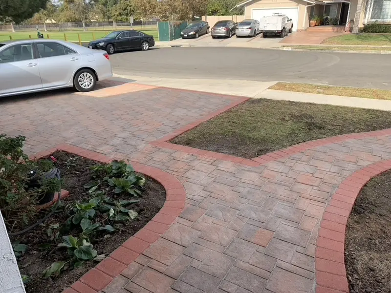 Paver walk and border course edging a planting bed and a strip of lawn