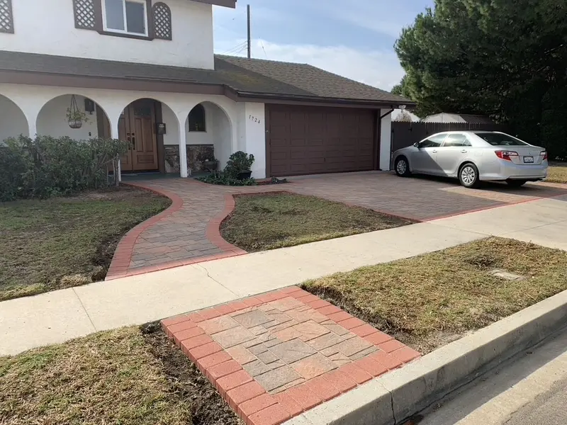 Paver walk leaving the public sidewalk and curving toward the front porch