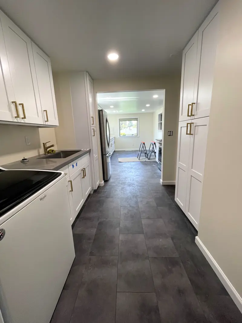 View from the remodeled laundry hall through the opening into the kitchen