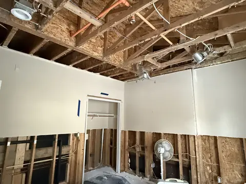 Ceiling and lower walls opened up after a water leak in a Shoreline home