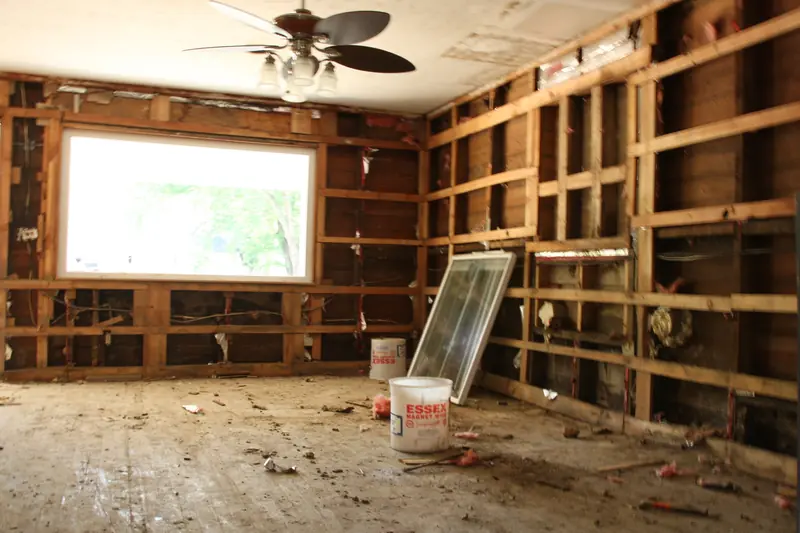 Room stripped to bare studs and subfloor after flooding