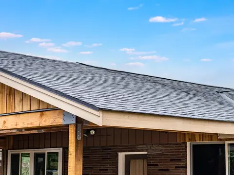 New shingle roof over a carport in Auburn, WA by Volcano Builders