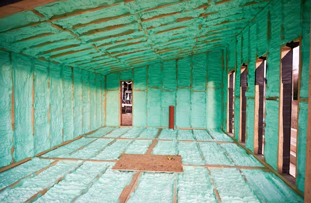 Wooden frame house thermal insulated by polyurethane foam. Construction and insulation concept