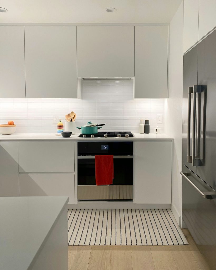 a kitchen with white cabinets